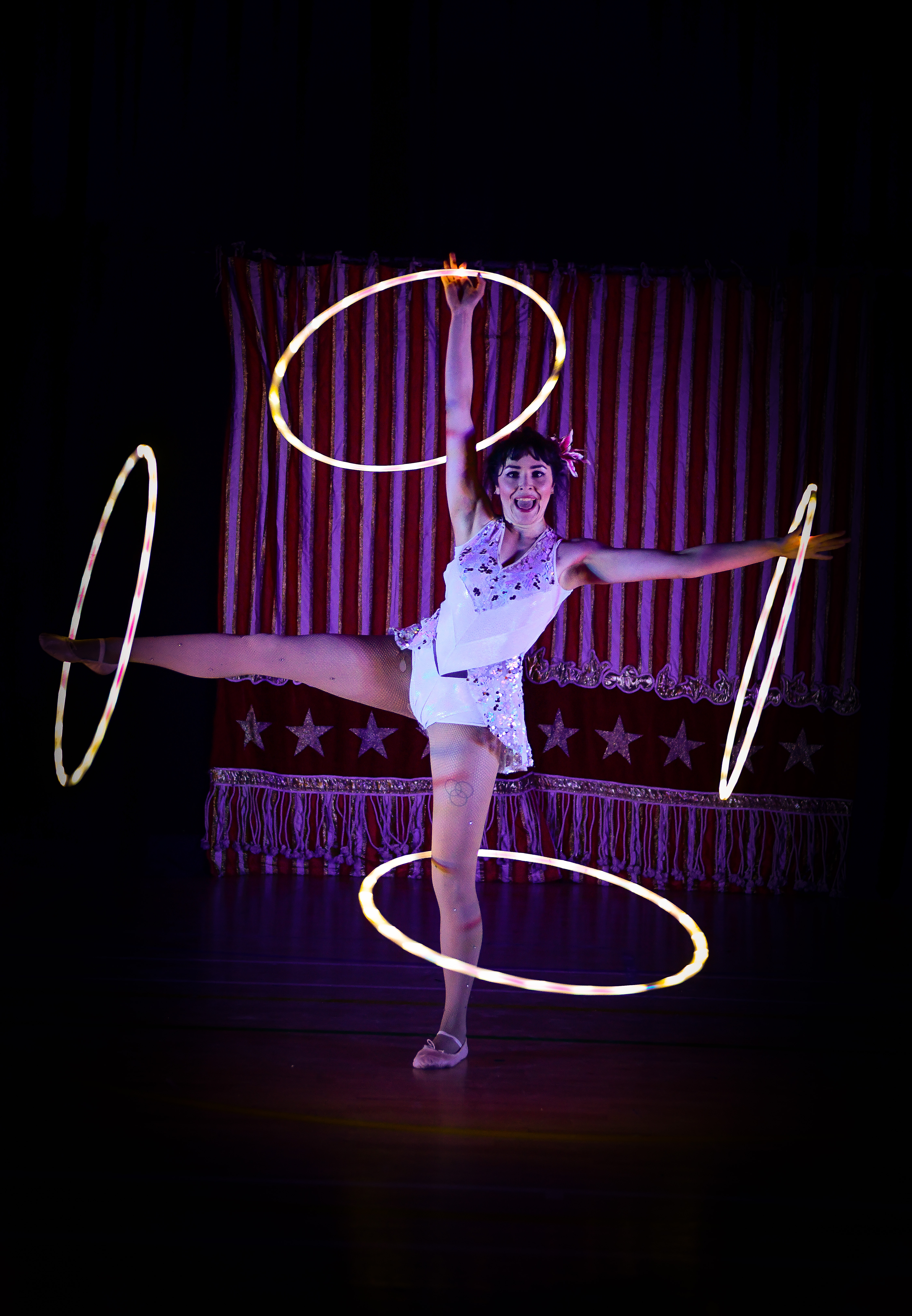 "An image of a woman with some light up hoola hoops"