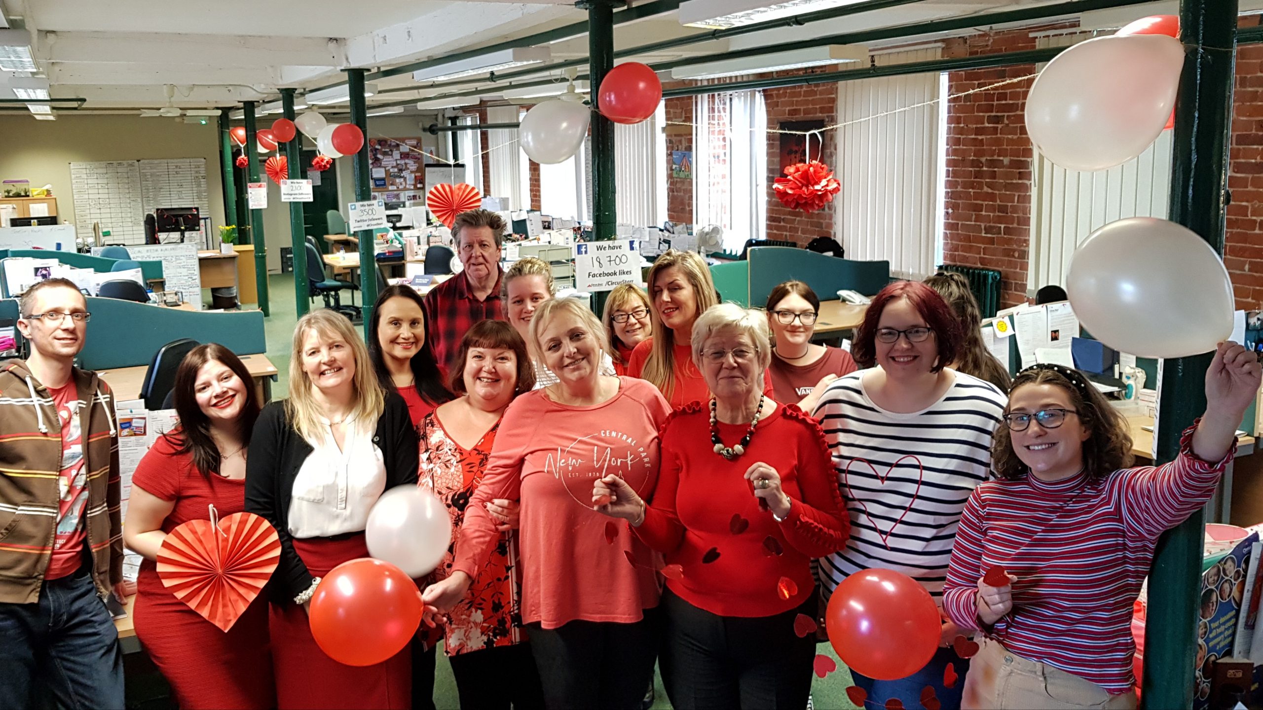 "An image of the Circus Starr team at the head office dressed in red"